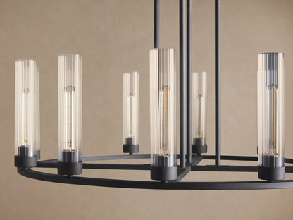 Andreas Round Chandelier, dark bronze finish. Circular frame holds multiple clear glass cylinder shades with visible filament bulbs.