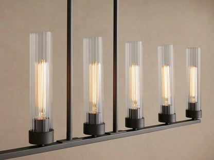 Andreas Linear Chandelier, dark bronze, 8 warm filament bulbs in clear ribbed glass, suspended by black chains.