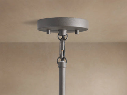 Andreas Pendant, a hanging fixture with a dark bronze finish, clear ribbed glass shade, and an exposed filament bulb.