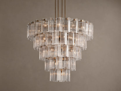 Delsie Round Chandelier: Tiered design with numerous clear vertical glass rods, burnished brass frame, brightly lit.