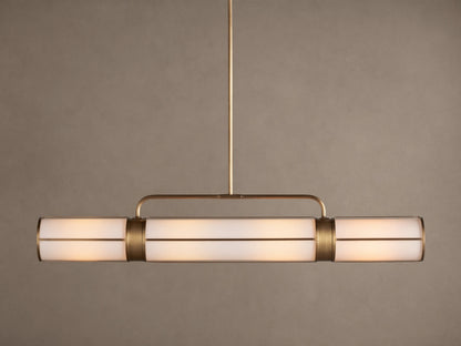 Remming Linear Chandelier: horizontal fixture with three glowing milk glass shades and burnished brass framework.