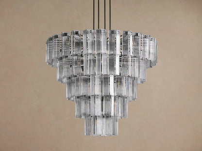 Delsie Round Chandelier, multi-tiered with clear fluted glass rods and dark frame, glowing brightly against a plain background.
