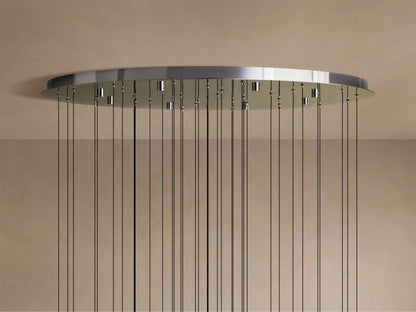 Close-up of the Solitaire Round Chandelier's teardrop-shaped glass pendants, each with a textured interior and metal accents.