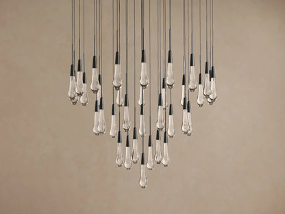 Soltaire Round Chandelier: many clear, bubble-filled teardrop glass lights with black caps, hanging at varying lengths.