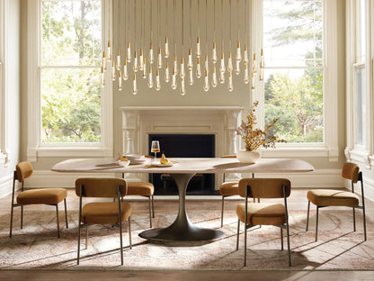 Soltaire Linear Chandelier with clear, teardrop-shaped glass pendants featuring sparkling internal LEDs, hanging at varying heights.
