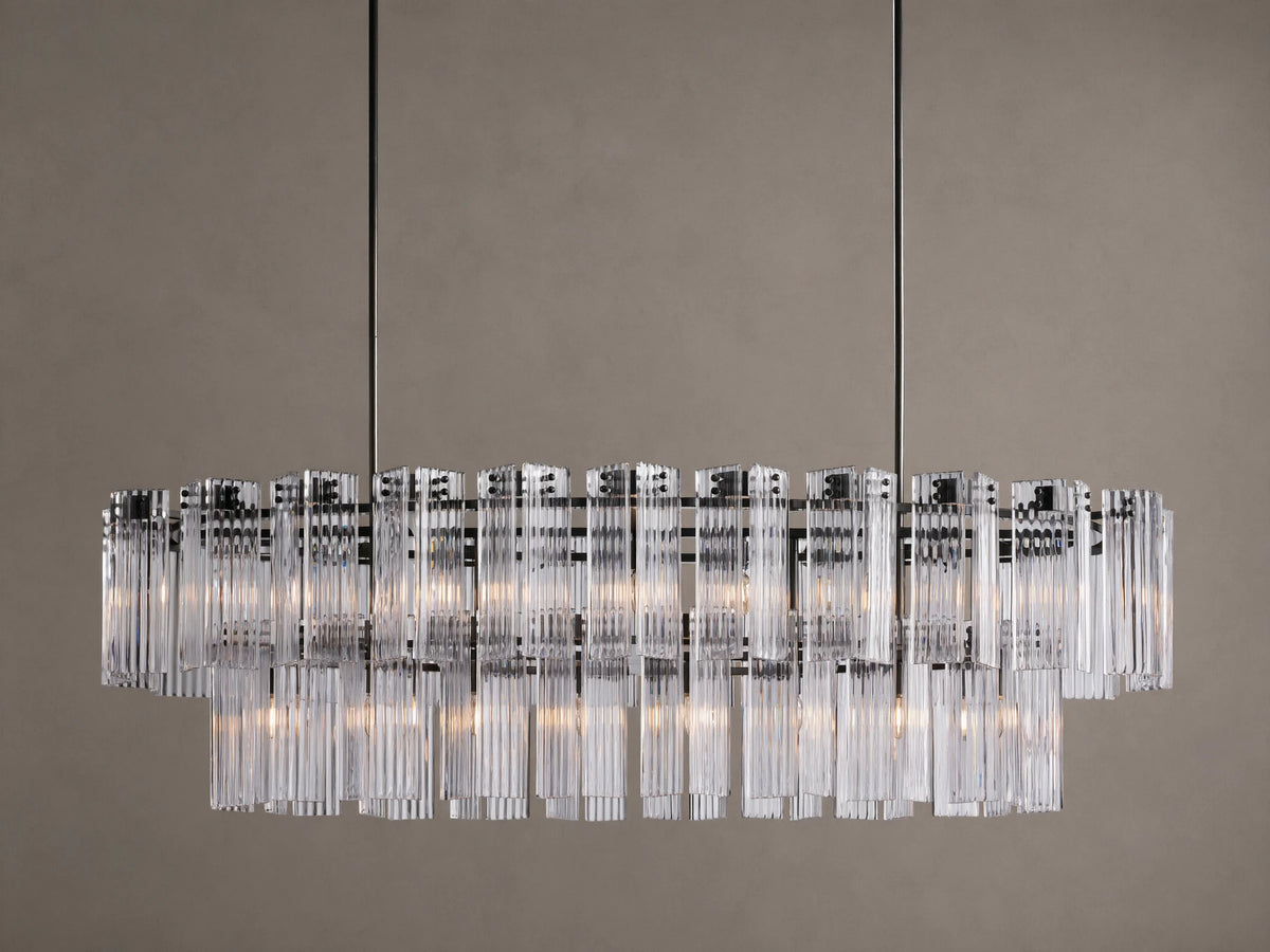 Illuminated Delsie Oval Tiered Chandelier with a dark bronze frame and multiple tiers of clear fluted glass rods.