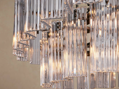 Delsie Oval Tiered Chandelier: Oval fixture, clear fluted glass rods in two tiers, dark metal frame, suspended.