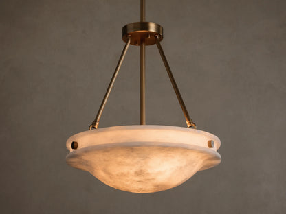 Front view of the Edith Pendant with a brass finish and a glowing, marbled alabaster stone shade.