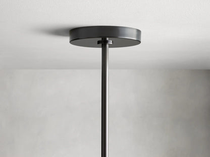 Noella Bronze Chandelier with visible Edison-style bulb in a clear glass orb shade, connected to a black metal rod.