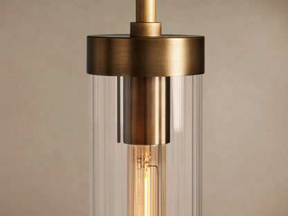 Andreas Pendant: brass-plated rod & fixture, clear fluted glass cylindrical shade, visible tubular filament bulb.