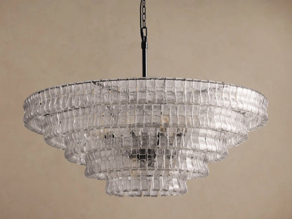 Ghiaccio Round Chandelier featuring multiple tiers of clear, wavy textured glass, suspended from a black chain.