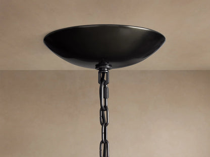 Ghiaccio Round Chandelier close-up: black, bowl-shaped ceiling canopy with a black chain hanging from a light ceiling.