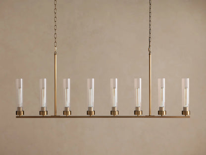 Andreas Linear Chandelier: 8-light, brass-finished, horizontal bar with clear cylindrical glass shades, exposing filament bulbs, hanging.