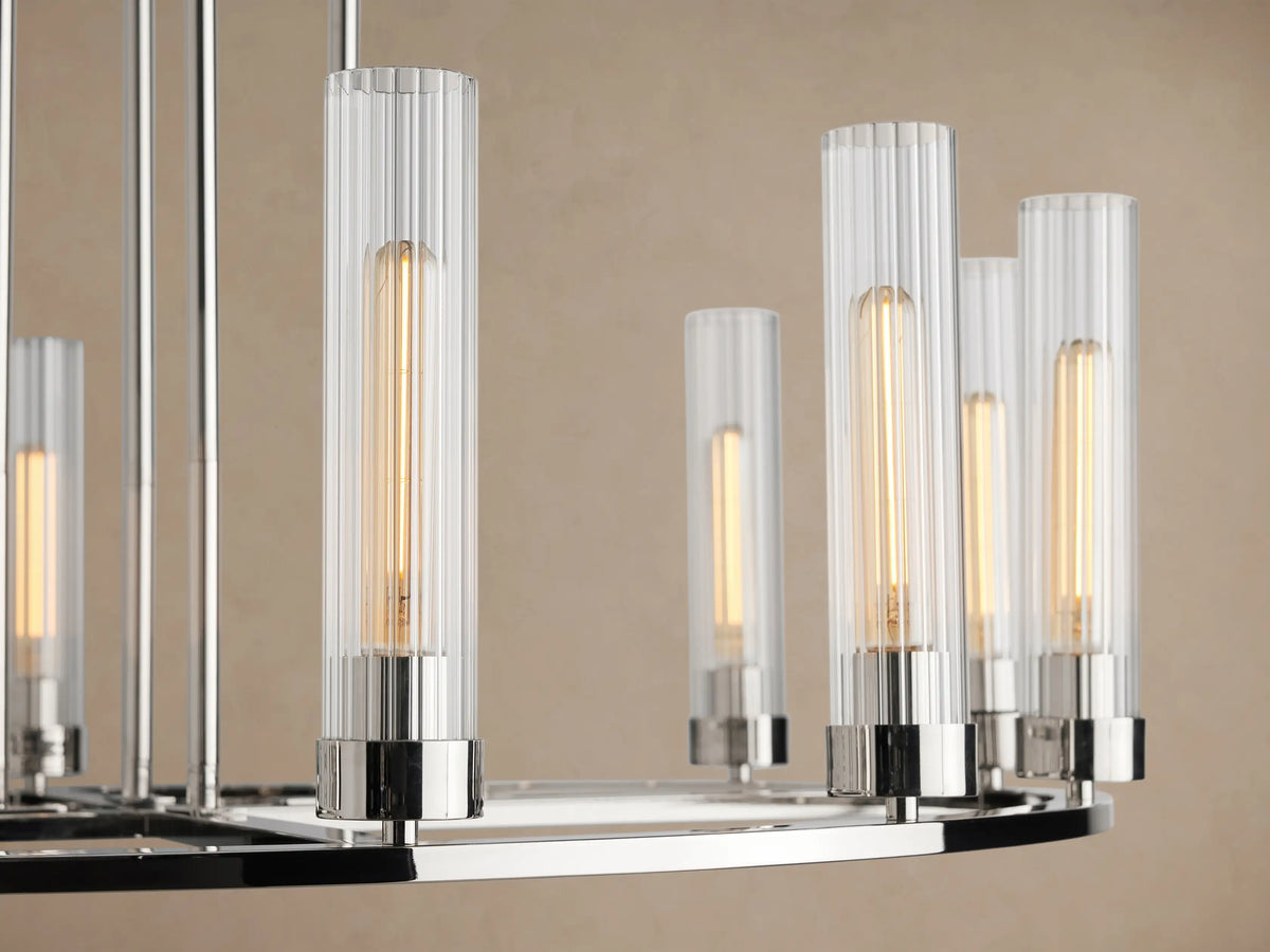 Polished nickel Andreas Round Chandelier with 10 clear fluted glass shades, each housing an exposed filament bulb. Suspended by chains.