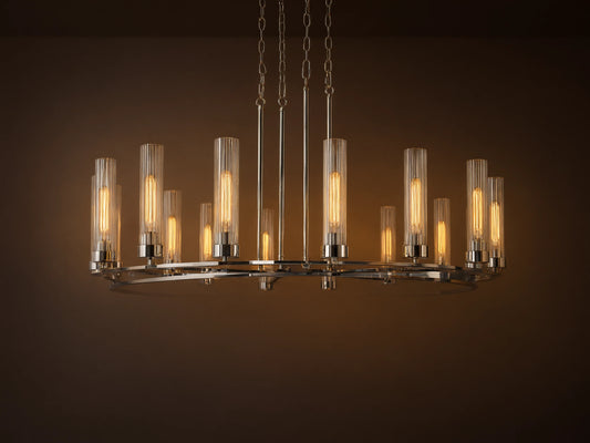 Andreas Round Chandelier, polished nickel finish, round frame, 12 glowing bulbs in clear fluted glass shades, suspended by chains.