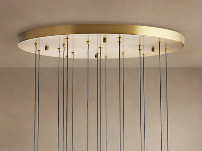 Soltaire Round Chandelier with a brass-finished rim, white ceiling plate, and many thin black cords hanging down.