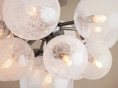 Mandoza Flush Mount: Cluster of clear, hand-blown glass globes with visible filament bulbs, attached to a light ceiling.