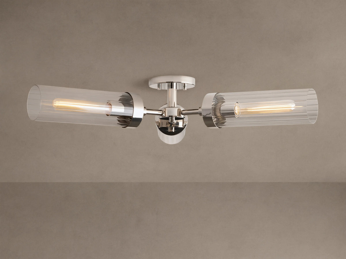 Andreas Flush Mount, polished nickel, with two horizontal clear ribbed glass shades, showcasing glowing filament bulbs.