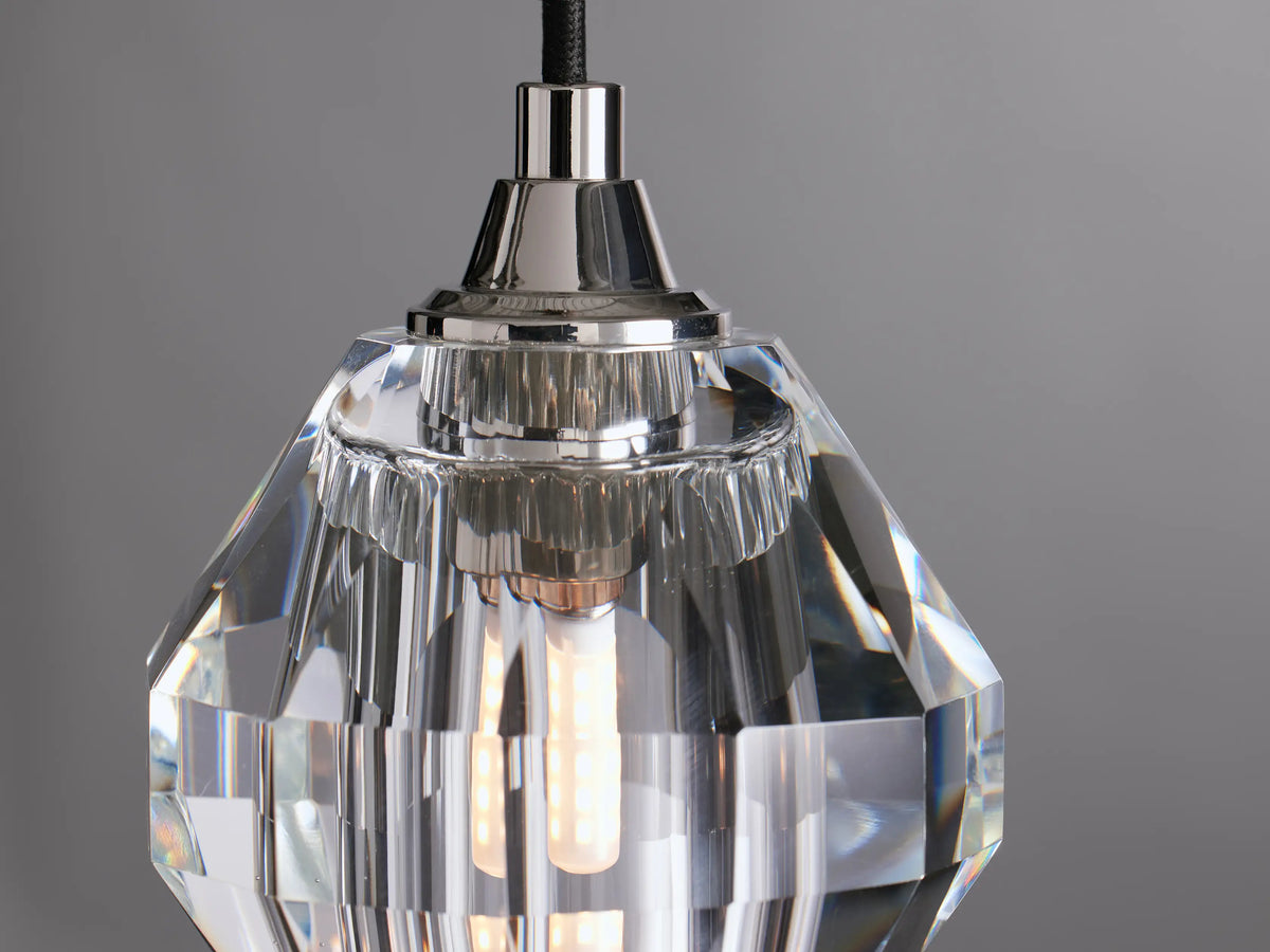 Amoroso Pendant with clear hand-cut crystal shade, suspended by a black fabric-wrapped cord, showing nickel finish.