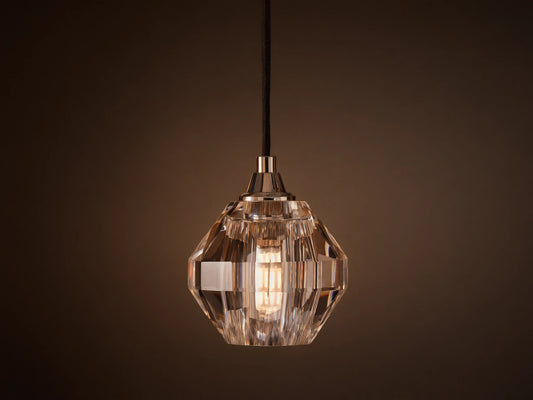 Amoroso Pendant with faceted crystal shade hanging from a black cord, showcasing a dimmable LED bulb inside.