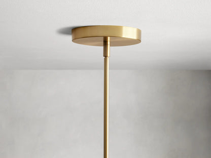 Organic 16" Pendant with amber mouth-blown glass shade, visible bulb inside, and brass fixture. Subtle texture on glass.
