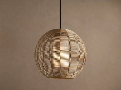 Cohen Globe Outdoor Pendant: natural woven wicker globe with internal glowing white glass shade, hanging from a matte black rod.