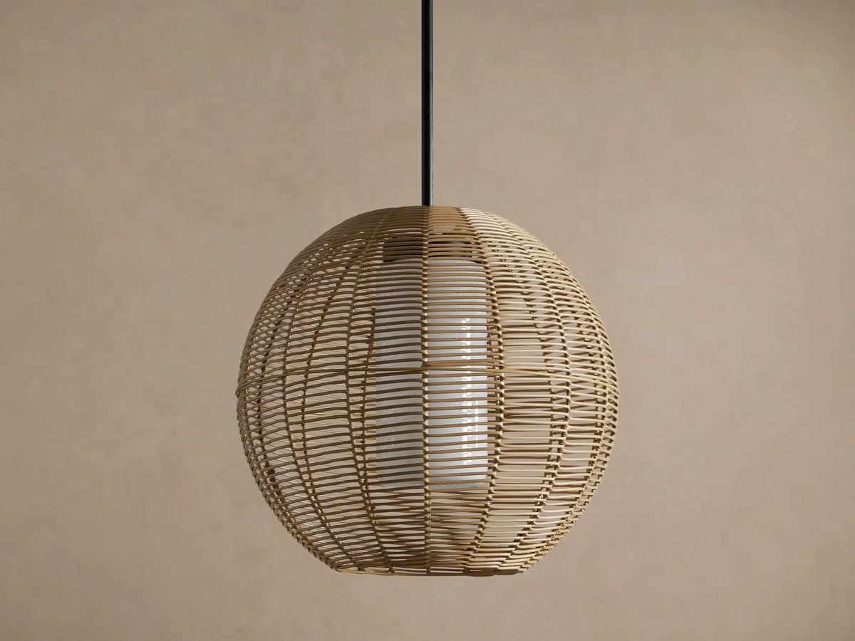 Cohen Globe Outdoor Pendant: natural woven wicker globe with internal glowing white glass shade, hanging from a matte black rod.