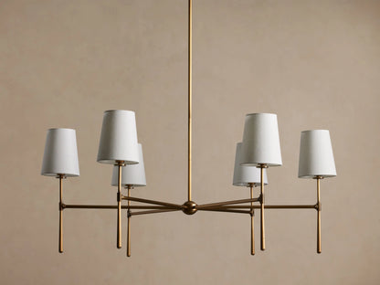 Rhodes Round Chandelier, 6-light, with burnished brass frame & 6 glowing tapered linen shades.