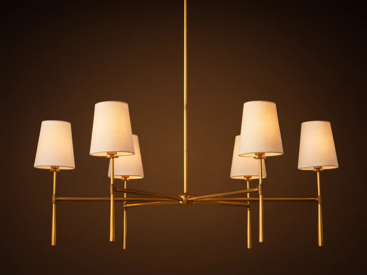 Rhodes Round Chandelier, 6-light, with burnished brass frame & 6 glowing tapered linen shades.