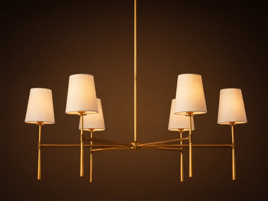 Rhodes Round Chandelier, 6-light, with burnished brass frame & 6 glowing tapered linen shades.