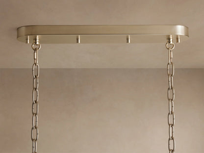 Neve Linear Chandelier's champagne-finished aluminum canopy mounted to a light ceiling, with two elegant hanging chains.