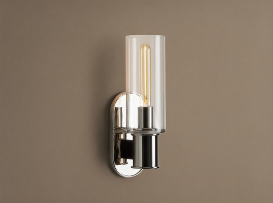 Harlin Sconce with polished nickel finish and clear glass cloche, mounted vertically on a wall, showing an Edison bulb.