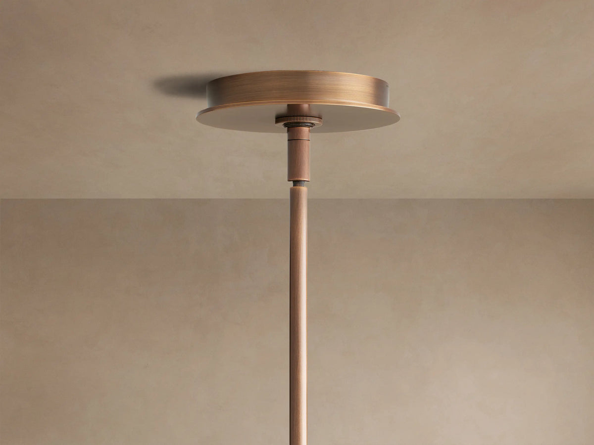 Daphne Chandelier close-up: dark bronze frame, cream fabric round shades with brown trim, visible from below and side.