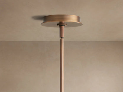 Daphne Chandelier close-up: dark bronze frame, cream fabric round shades with brown trim, visible from below and side.