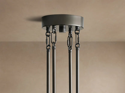 Delsie Round Chandelier, close-up of layered clear fluted glass rods & dark bronze metal frame, reflecting light.