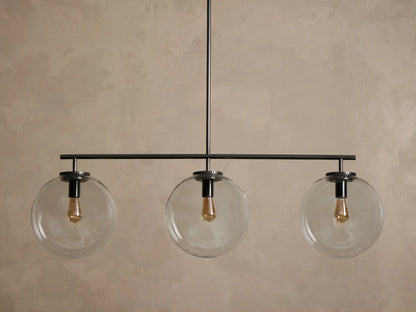 Upward view of a dark metallic light fixture ceiling mount, with a circular canopy, ridged edge, and connecting rod.