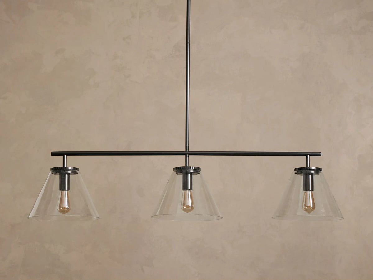 Close-up of dark bronze ceiling mount with a circular canopy, geared edge, and a descending metal rod.