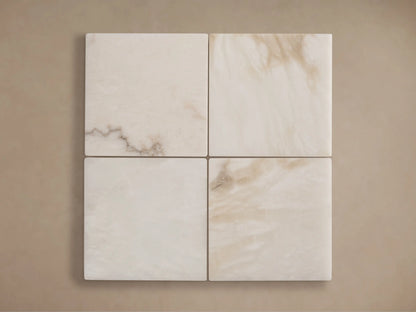 Four square cream alabaster stone samples with natural brown veining, material for the Emerie Table Lamp shade.