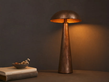 Chantou Table Lamp, antiqued brown, copper & pewter finish, mushroom shade & conical base, casting warm light.