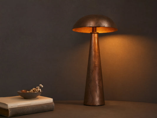 Chantou Table Lamp, antiqued brown, copper & pewter finish, mushroom shade & conical base, casting warm light.