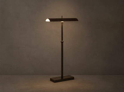 Abel Leather Floor Lamp: dark bronze finish, horizontal leather shade emitting warm LED light, stands on a wood floor.