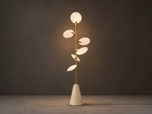 Lyla Floor Lamp: conical travertine base, golden stem with six glowing leaf-shaped white glass diffusers spirally.