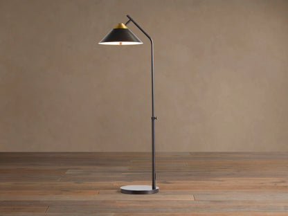 Marquee Bronze Task Floor Lamp. Dark bronze iron frame, conical shade with brass accent, adjustable pole, round base. Light on.