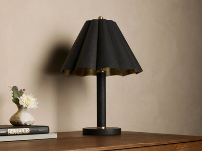 Lucy Accent Table Lamp, black pleated leather shade with gold interior, black leather-wrapped stem, and brass accents on wood.
