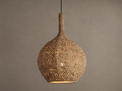 Canela 15" Pendant: Bell-shaped, natural tan handwoven banana rope fixture, glowing warmly, suspended.