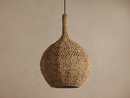 Canela 15" Pendant: Bell-shaped, natural tan handwoven banana rope fixture, glowing warmly, suspended.