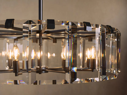 Chandelier with rectangular crystal panels and visible bulbs, emitting warm light. Black metal frame and soft background glow.