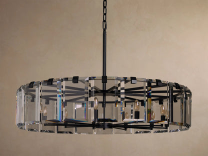 A round chandelier with clear glass panels, black metal frame, and multiple candle-style bulbs, hanging from a black chain.