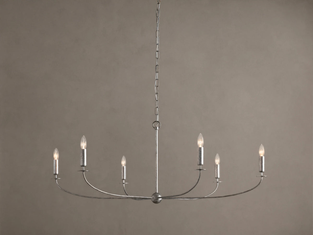 Arnett Round Chandelier. Antiqued silver finish iron frame, 6 candelabra bulbs on curved arms, hanging from chain.
