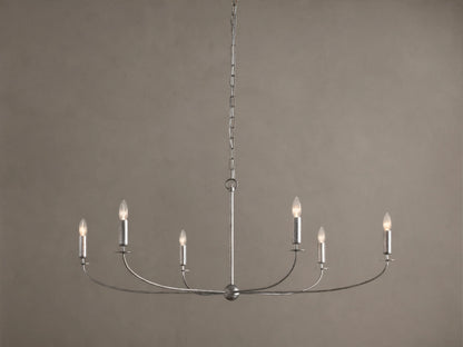 Arnett Round Chandelier. Antiqued silver finish iron frame, 6 candelabra bulbs on curved arms, hanging from chain.